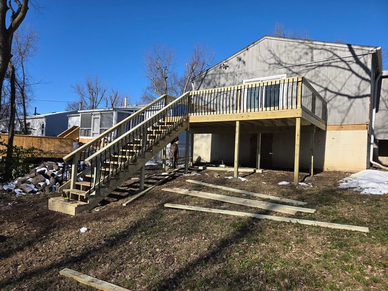 Elevated wood deck with a long stair run